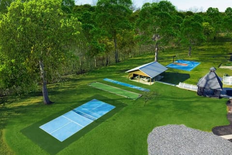 [Backyard] full of fun with pickleball, bocce, shuffleboard, basketball, and 2 pavilions for entertaining