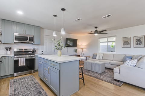 Open concept kitchen and living area to share time with family and friends. 