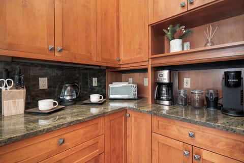 - Start your mornings at this well stocked coffee nook with drip machine, kettle, and toaster - Beautiful granite counters and natural wood cabinetry create a cozy vibe - Brew, toast, and sip your way into a perfect mountain day
