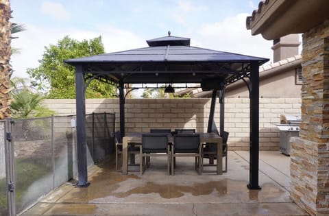 Patio includes outdoor heater, gas grill and Mediterranean charcoal grill 