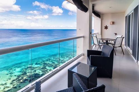 Relax on your private balcony overlooking the pool, beach and ocean.