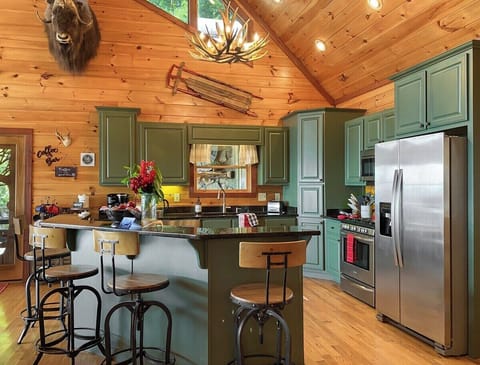 …with island seating and a suite of stainless steel appliances!