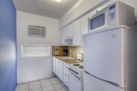 Fridge, microwave, coffee/tea maker, cleaning supplies