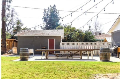 Private backyard shaded by huge evergreens