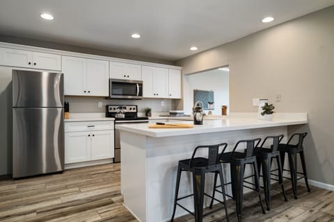 Kitchen view with hot tea kettle and french press.