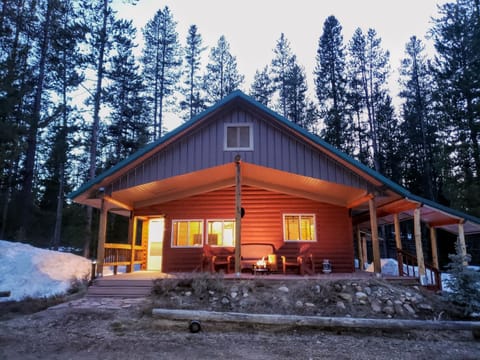 The Bonanza Cabin - behold the enchanting view from the front of the cabin as the day gently transitions to night, creating a serene and captivating ambiance.