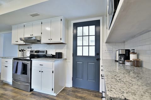 Kitchen has it all: modern cooking appliances & spacious countertops