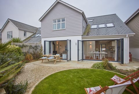5 The Sands, Polzeath. The sitting/living area opening up into the beautiful back garden