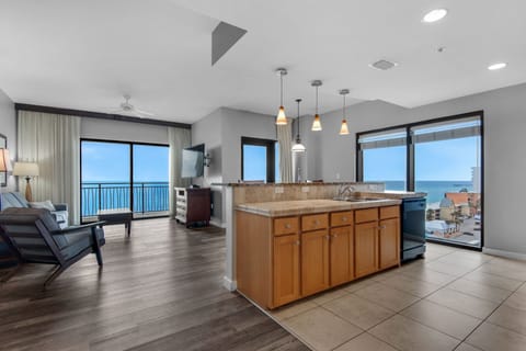 Living Room - This luxurious beachfront living room offers ultimate comfort, a spacious layout, a large flat-screen TV, and endless ocean views for the perfect retreat.