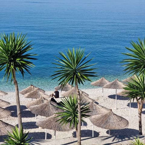 Private beach, white sand, sun loungers, beach umbrellas