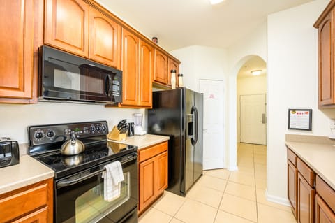 Kitchen with dishwasher, stove, micro, fridge w/ice & water, coffee maker, etc