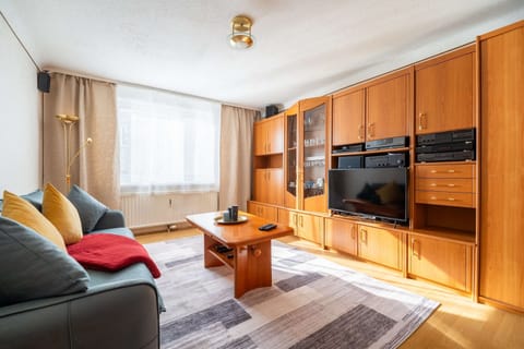Cozy Living Room with Plush Seating & Smart Entertainment - Ideal for Evenings In or Movie Nights