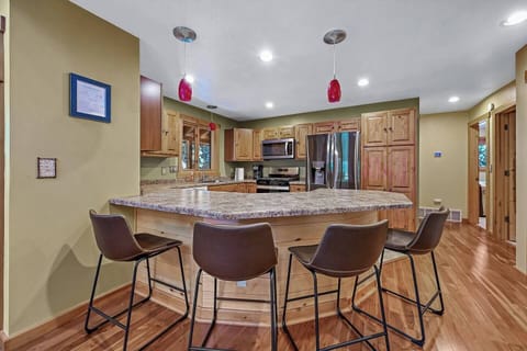For those who like to stay in and eat, the kitchen is perfect for cooking for cooking and stocked with the essential pots, pans, and utensils.  Island seating for 4 allows for guest to gather and chat while cooking.