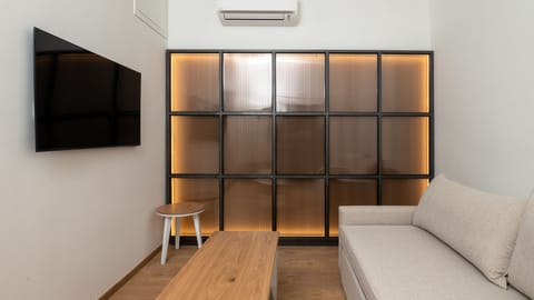 Family-Two Bedroom Suite with Balcony & Panoramic Lake and City View | Living area | 32-inch Smart TV with satellite channels, TV