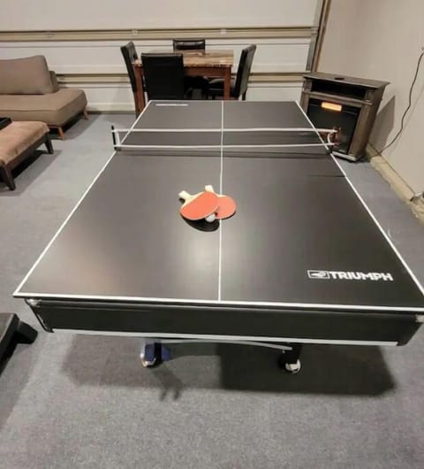 Game room.table,sectional,TV, hot tub, pool table/table tennis, darts, bsktball