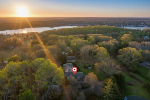[Aerial Property View] Aerial view showing the home and its large private lawn