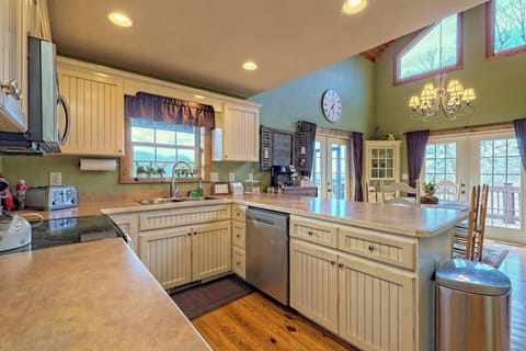 Cute country kitchen with lots of countertop space and light from all angles!