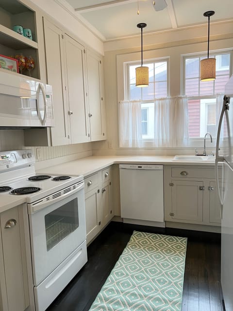 Kitchen comes equipped with microwave, coffee maker, toaster and dishwasher.