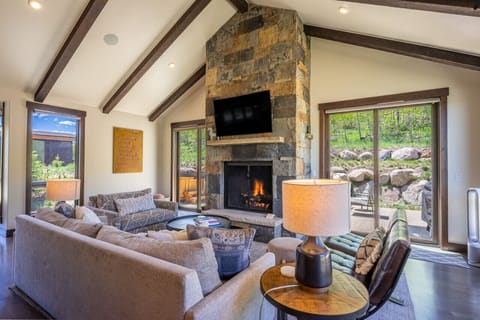 Bright and open living area with a fireplace to cozy up by