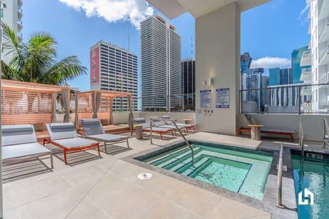 There's a shared jacuzzi at the swimming pool on the deck!