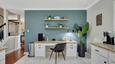 The work area is just next to the coffee station for peak performance