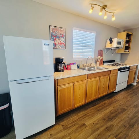 Fully Stocked Kitchen with Coffee + Snacks.