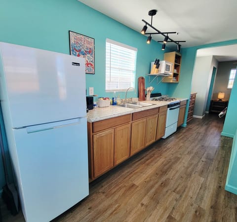 Fully Stocked Kitchen with Coffee + Snacks.