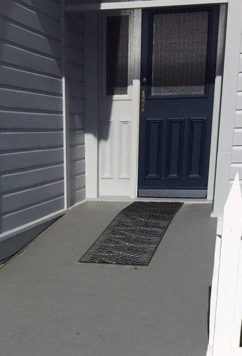 Ramped front-door entrance into this self-contained East-Wing