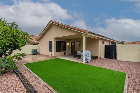 Private backyard with turf, BBQ and comfortable seating