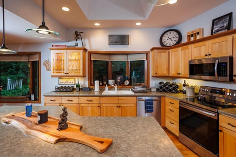 Counter space galore to prepare, serve and enjoy meals together