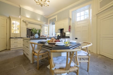 Kitchen with American fridge/freezer and island with seating for four guests