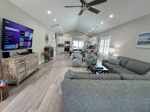 Huge great room, vaulted ceiling, dimmable lighting and ceiling fans throughout