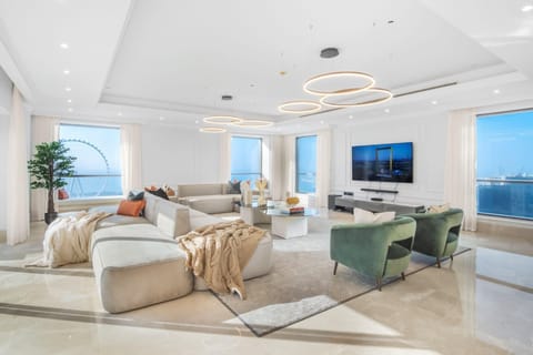 Stunning contemporary open plan lounge with panoramic views and direct access to the pool