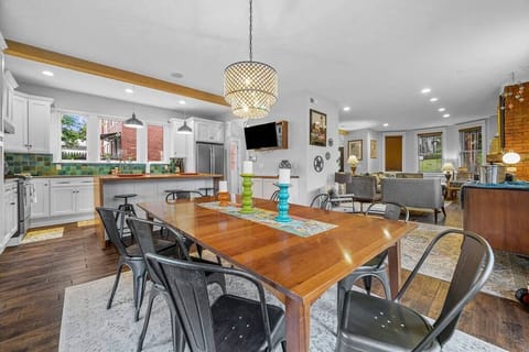 A large family table and openness into the kitchen Island area make gathering with friends and family something special!