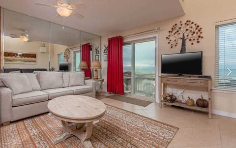 The living room with direct access to the balcony.
