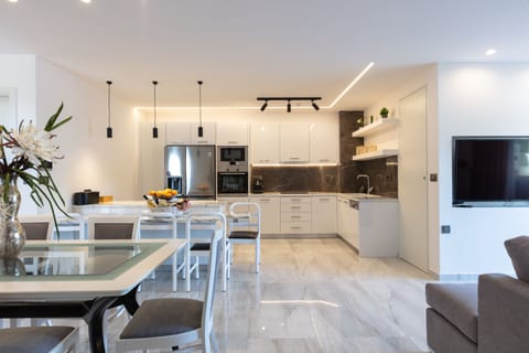 At the lower floor youll find a second fully equipped kitchen with an island and seating for four