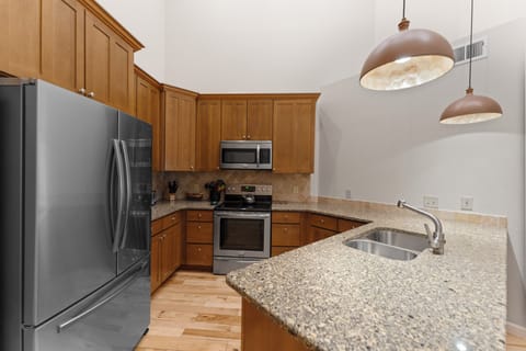 Full, updated kitchen with stainless steel appliances