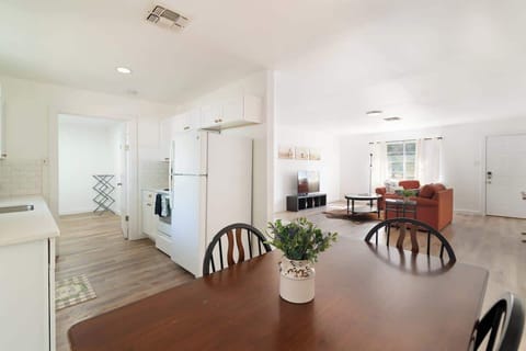 Open-concept dining and living area with plenty of natural light, perfect for relaxing or entertaining