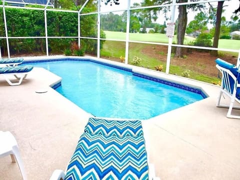The screened pool has plenty of patio seating