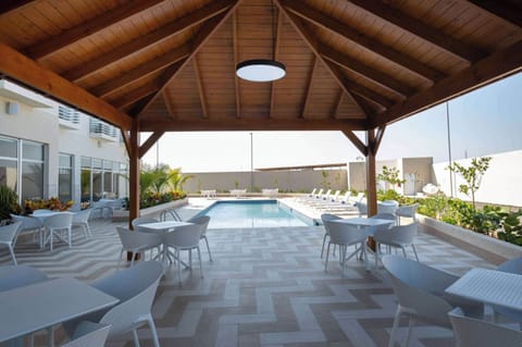 Outdoor pool, open 10:00 AM to 6:00 PM, pool umbrellas, sun loungers