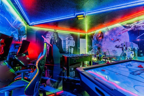 Gaming fun galore: air hockey, foosball, skeeball, and an Xbox with 4 chairs.