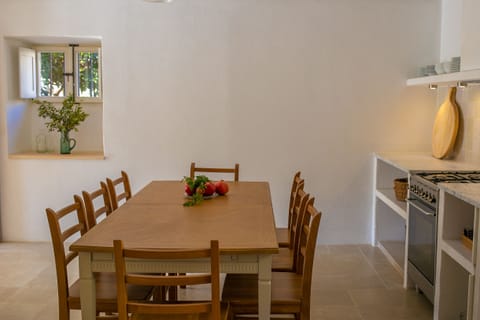 The cool, beamed, ground floor kitchen for relaxed indoor dining for ten