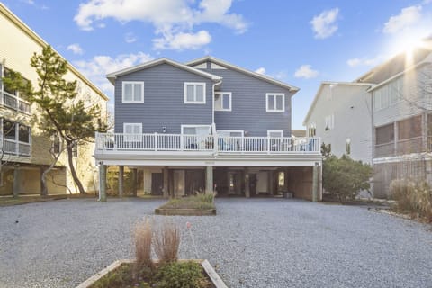 39562 Admiral Rd, North Bethany - townhouse - A rear view of the contemporary townhome featuring expansive private decking and covered parking, perfectly positioned within the Tower Shores community.