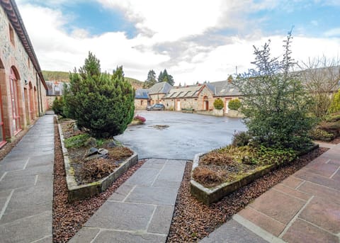 The courtyard area with EV charger in the background