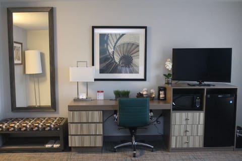 Desk, laptop workspace, iron/ironing board, free cribs/infant beds