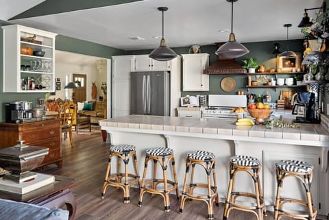 A French styled chef's kitchen with literally everything you can think of to create meals for family and friends.....well, everything but an air fryer.  ;)
