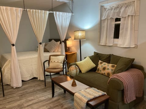 Relax in bed or on the love seat.  The television can be viewed from both.