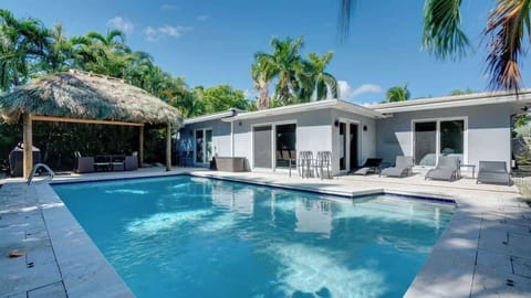 Huge private outdoor space with a Pool, BBQ grills, lounge chairs, and outdoor table
