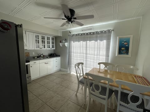 Eat in kitchen and sliders off to the fenced in backyard