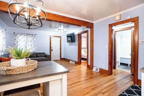 Looking into the cozy living room from the kitchen. High top dining table seats 4 guests